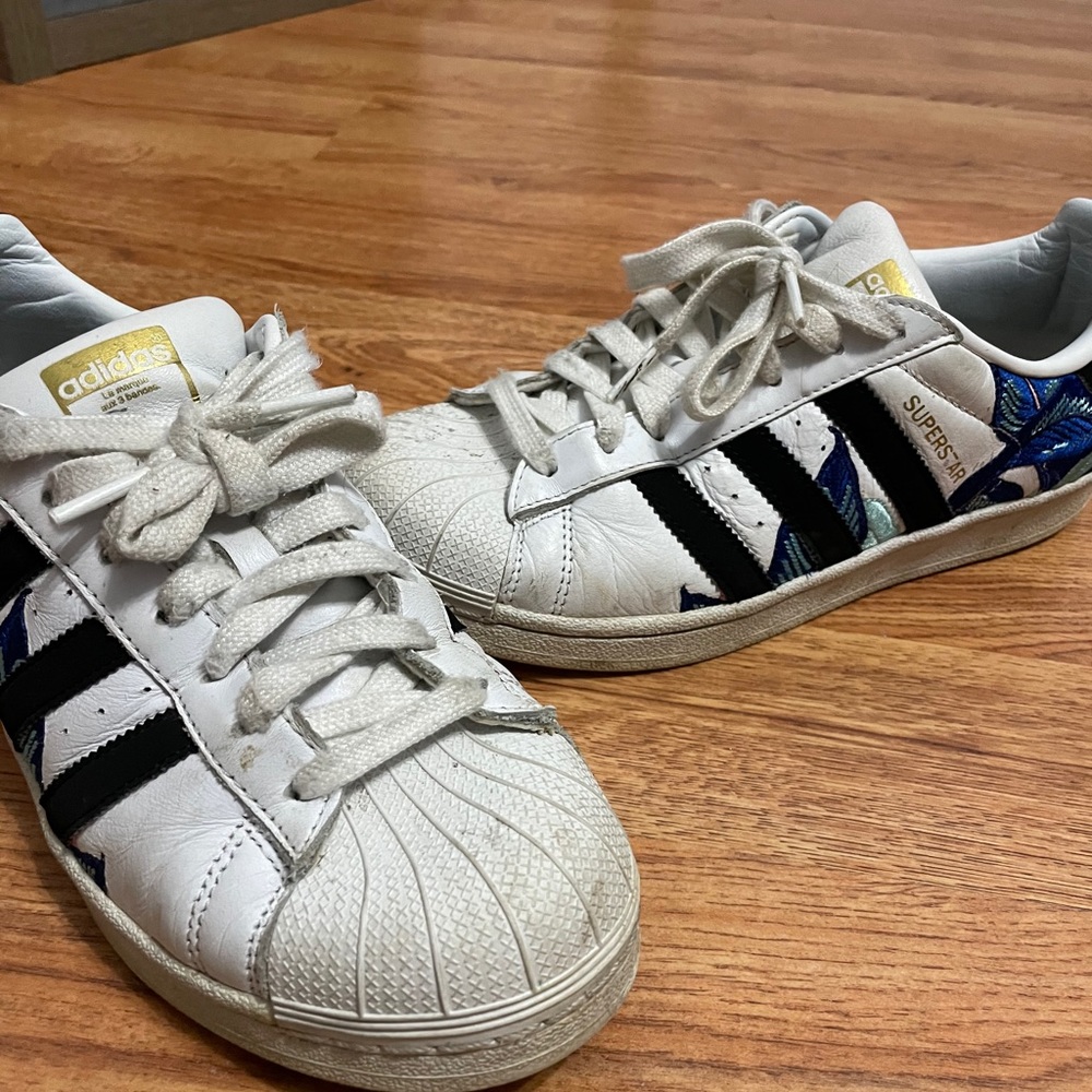 Adidas superstar with flower pattern